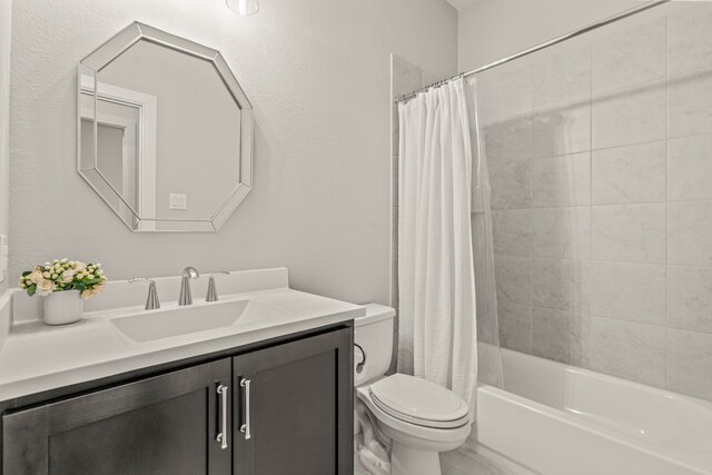 full bathroom featuring toilet, vanity, and shower / bath combination with curtain