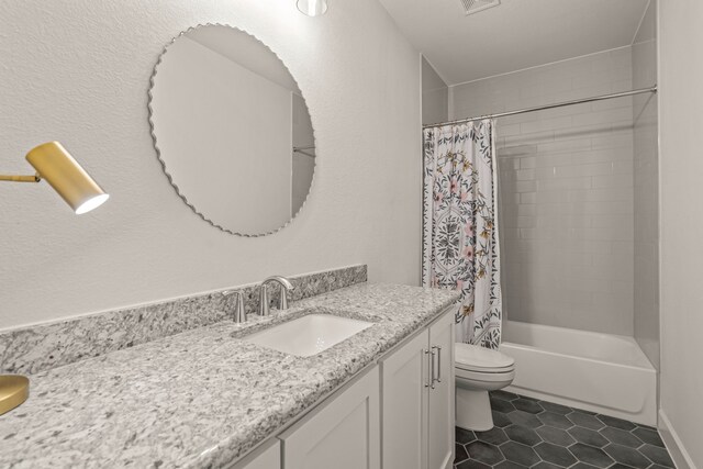 full bathroom with shower / bath combination with curtain, vanity, tile patterned flooring, and toilet