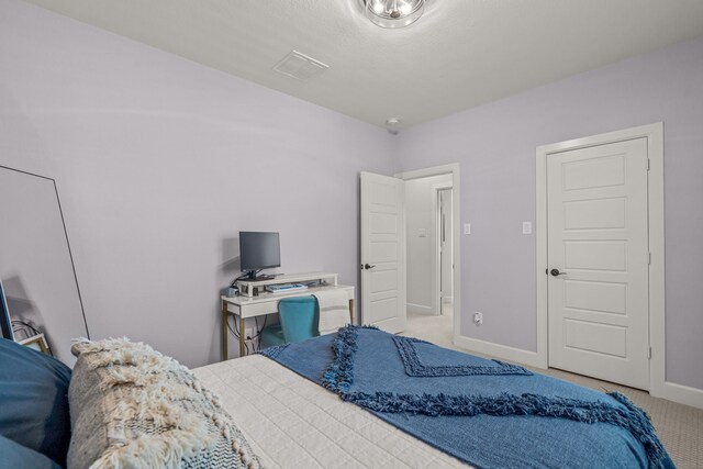 bedroom with baseboards and carpet flooring