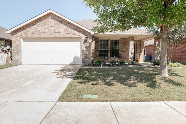 ranch-style house with an attached garage, a front lawn, brick siding, and concrete driveway