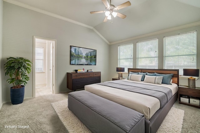 bedroom with vaulted ceiling, baseboards, light colored carpet, ensuite bath, and ornamental molding
