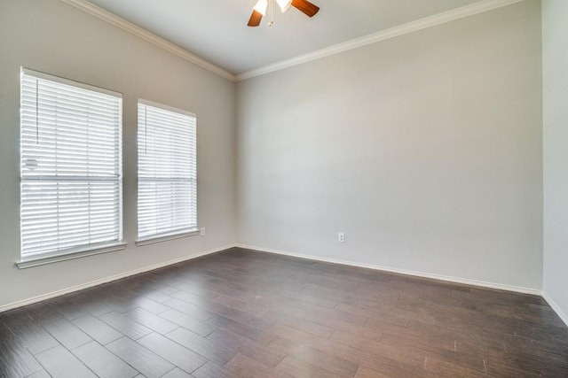 empty room featuring ornamental molding, baseboards, a ceiling fan, and dark wood-type flooring