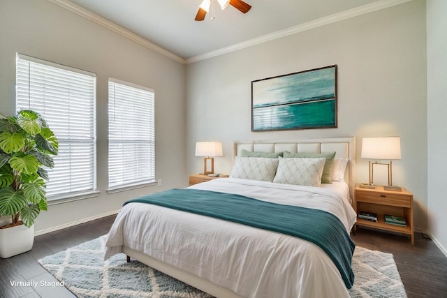 bedroom featuring wood finished floors, crown molding, baseboards, and a ceiling fan