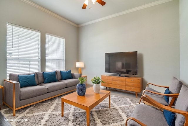 living room featuring light wood-type flooring, ornamental molding, and ceiling fan