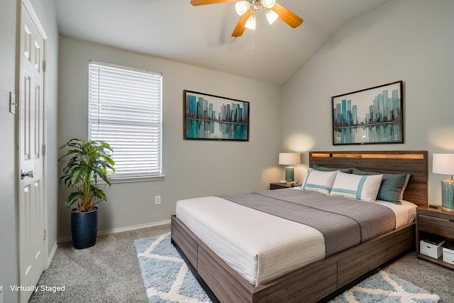 bedroom with vaulted ceiling, carpet, baseboards, and ceiling fan