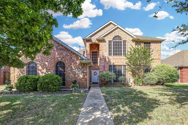 816 Flagstone Dr, Burleson, TX 76028 - traditional-style house featuring brick siding and a front yard