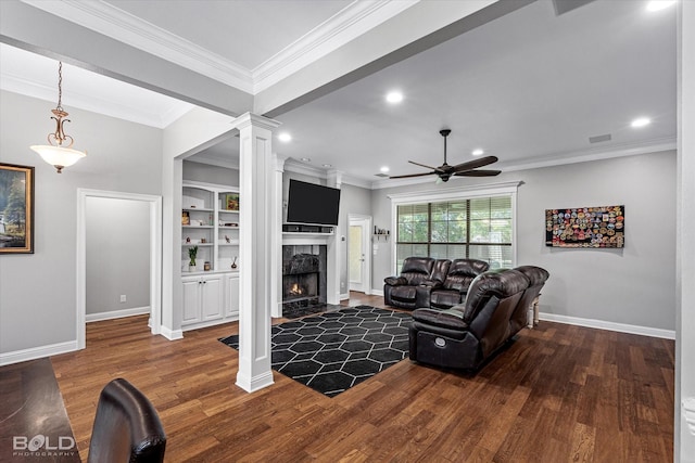 living room with ceiling fan, crown molding, wood finished floors, and a high end fireplace