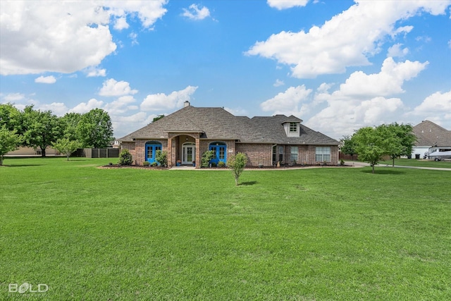 view of front of property featuring brick siding and a front lawn