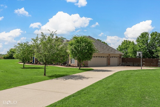 view of front of home with a garage, driveway, fence, a front yard, and brick siding