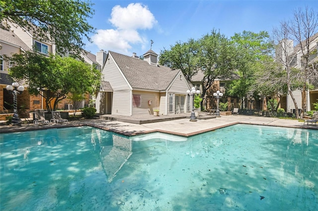 outdoor pool featuring a patio area