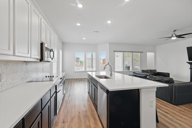 3120 Bent Creek Dr, Anna, TX 75409 - kitchen with a sink, appliances with stainless steel finishes, light wood-type flooring, light countertops, and recessed lighting