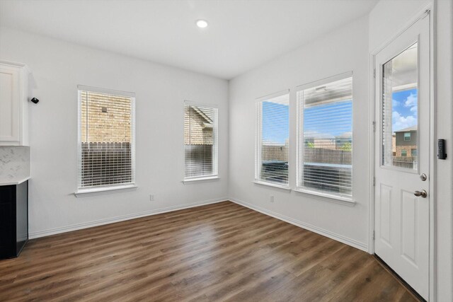 3120 Bent Creek Dr, Anna, TX 75409 - unfurnished dining area with dark wood-style flooring, recessed lighting, and baseboards