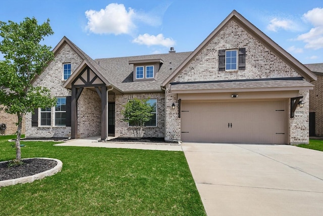 3120 Bent Creek Dr, Anna, TX 75409 - view of front of home with a front lawn, concrete driveway, a garage, a shingled roof, and brick siding