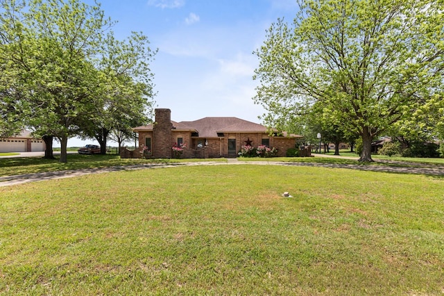 1502 Hinchliffe Rd, Mexia, TX 76667 - view of front facade with a chimney and a front lawn