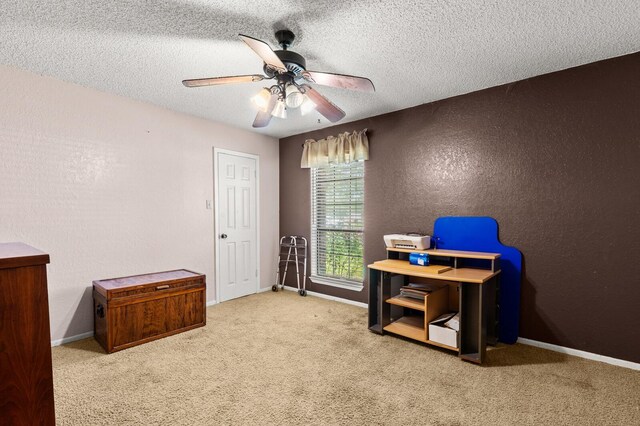1502 Hinchliffe Rd, Mexia, TX 76667 - office area featuring a textured wall, carpet flooring, a textured ceiling, and ceiling fan