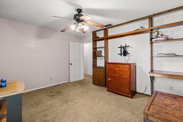 1502 Hinchliffe Rd, Mexia, TX 76667 - unfurnished bedroom with light carpet, baseboards, visible vents, and a textured ceiling