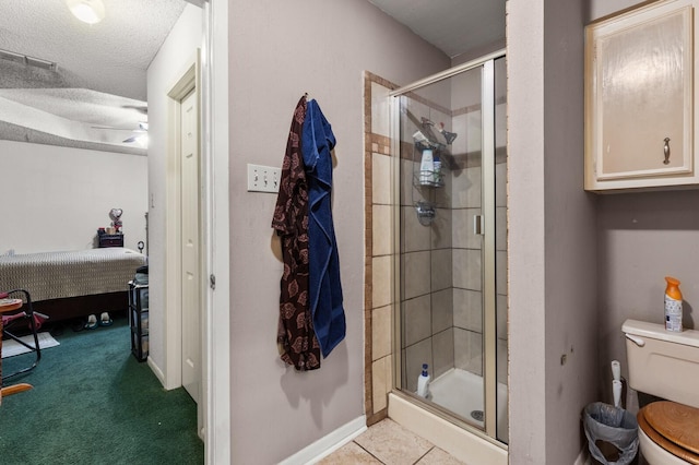 1502 Hinchliffe Rd, Mexia, TX 76667 - bathroom featuring a textured ceiling, toilet, ensuite bathroom, visible vents, and a shower stall