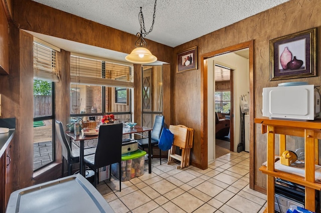 1502 Hinchliffe Rd, Mexia, TX 76667 - dining area featuring a textured ceiling and light tile patterned floors