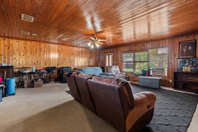 1502 Hinchliffe Rd, Mexia, TX 76667 - cinema room featuring visible vents, wood walls, ceiling fan, wooden ceiling, and carpet floors