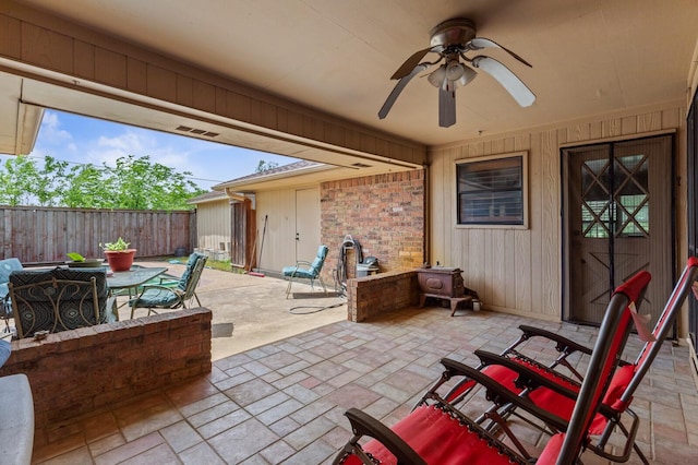 1502 Hinchliffe Rd, Mexia, TX 76667 - view of patio / terrace featuring fence, ceiling fan, and outdoor dining area