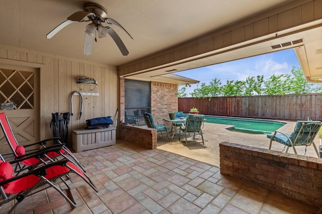 1502 Hinchliffe Rd, Mexia, TX 76667 - view of patio / terrace with a fenced backyard, a fenced in pool, ceiling fan, and outdoor dining area