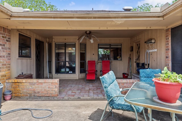 1502 Hinchliffe Rd, Mexia, TX 76667 - view of exterior entry featuring outdoor dining area, roof with shingles, and a patio