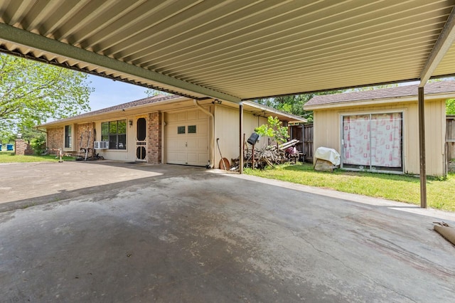 1502 Hinchliffe Rd, Mexia, TX 76667 - view of patio featuring fence and a garage