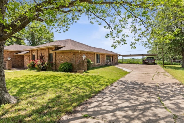 1502 Hinchliffe Rd, Mexia, TX 76667 - single story home featuring a front lawn, brick siding, a carport, and driveway