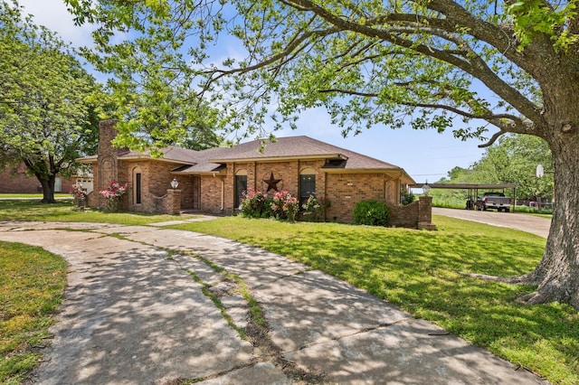 1502 Hinchliffe Rd, Mexia, TX 76667 - ranch-style house featuring a chimney, brick siding, a front yard, and concrete driveway