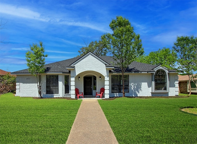 405 Derby Ln, Desoto, TX 75115 - single story home with a shingled roof, brick siding, and a front yard