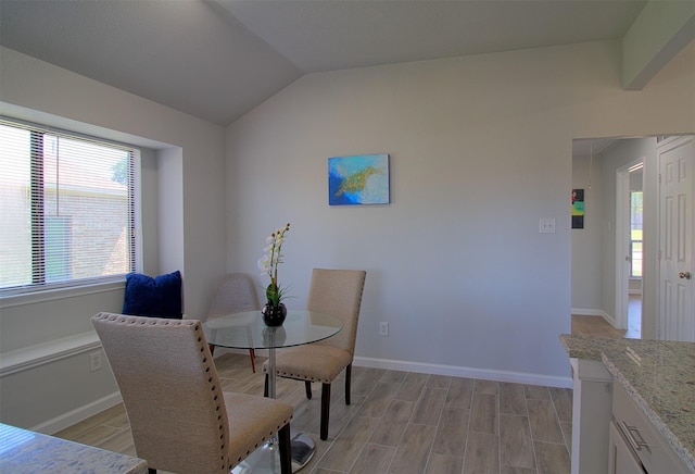 405 Derby Ln, Desoto, TX 75115 - dining space with vaulted ceiling, a healthy amount of sunlight, baseboards, and light wood-style flooring