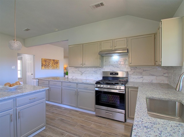 405 Derby Ln, Desoto, TX 75115 - kitchen featuring under cabinet range hood, visible vents, a sink, and stainless steel gas range