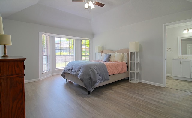 405 Derby Ln, Desoto, TX 75115 - bedroom with baseboards, lofted ceiling, and light wood-type flooring