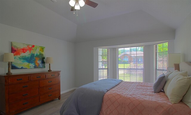 405 Derby Ln, Desoto, TX 75115 - bedroom with lofted ceiling, a ceiling fan, baseboards, and light wood-style flooring
