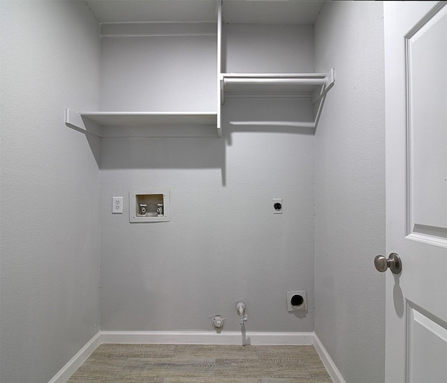 405 Derby Ln, Desoto, TX 75115 - laundry room featuring wood finished floors, hookup for a washing machine, hookup for an electric dryer, hookup for a gas dryer, and laundry area
