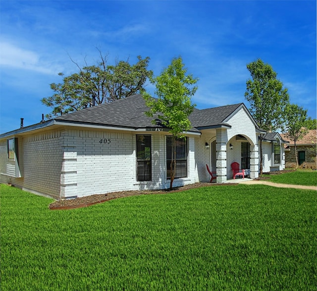 405 Derby Ln, Desoto, TX 75115 - view of front of home with a shingled roof, a front lawn, and brick siding