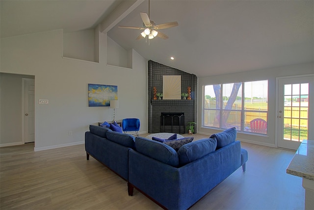 405 Derby Ln, Desoto, TX 75115 - living room featuring a fireplace, light wood finished floors, high vaulted ceiling, and ceiling fan