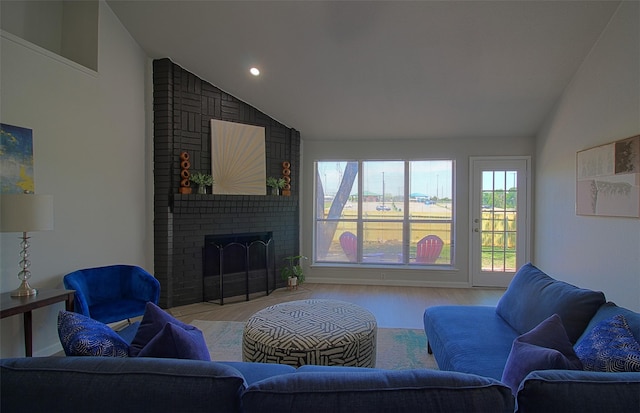 405 Derby Ln, Desoto, TX 75115 - living room with recessed lighting, lofted ceiling, a brick fireplace, and light wood-type flooring