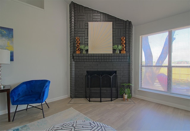 405 Derby Ln, Desoto, TX 75115 - living area with lofted ceiling, baseboards, wood finished floors, and a fireplace
