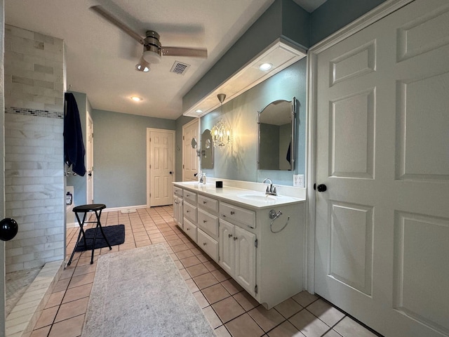 full bathroom featuring a ceiling fan, tile patterned floors, visible vents, and a sink