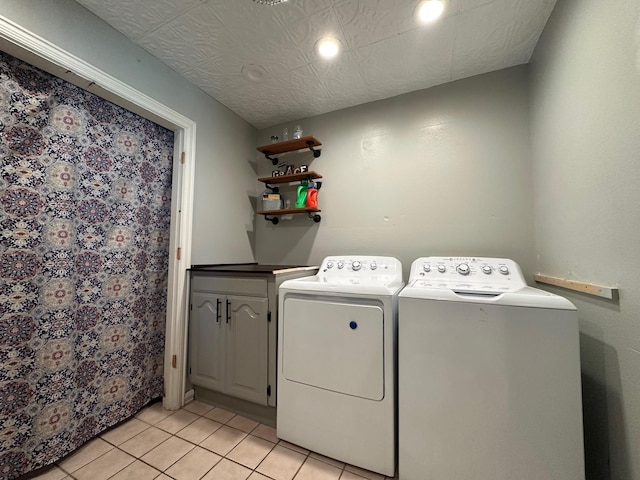 washroom with light tile patterned flooring, cabinet space, recessed lighting, and separate washer and dryer