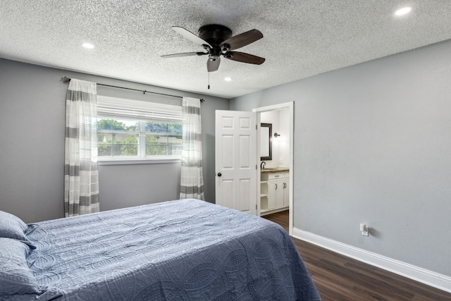 609 Admiralty Way, Fort Worth, TX 76108 - bedroom featuring wood finished floors, a textured ceiling, connected bathroom, baseboards, and recessed lighting