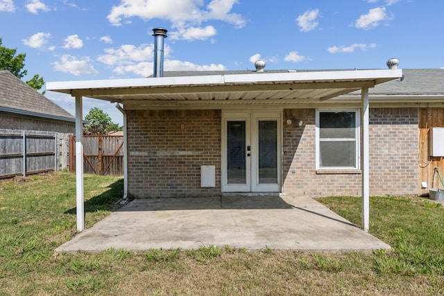 609 Admiralty Way, Fort Worth, TX 76108 - back of property featuring fence, french doors, a patio, a lawn, and brick siding