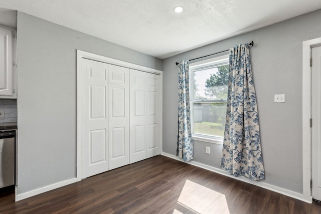 609 Admiralty Way, Fort Worth, TX 76108 - unfurnished bedroom with recessed lighting, baseboards, dark wood-type flooring, and a closet