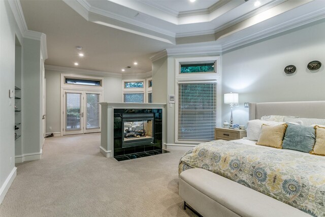 bedroom featuring baseboards, ornamental molding, carpet, and a fireplace