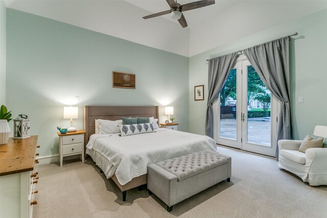 carpeted bedroom featuring access to outside, a ceiling fan, and vaulted ceiling