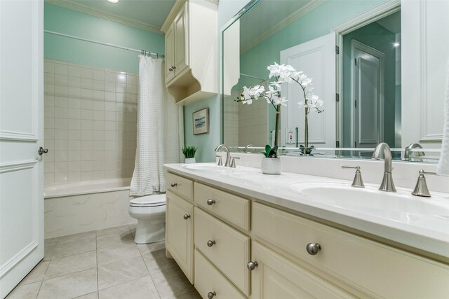 full bathroom featuring tile patterned flooring, shower / tub combo with curtain, ornamental molding, toilet, and a sink