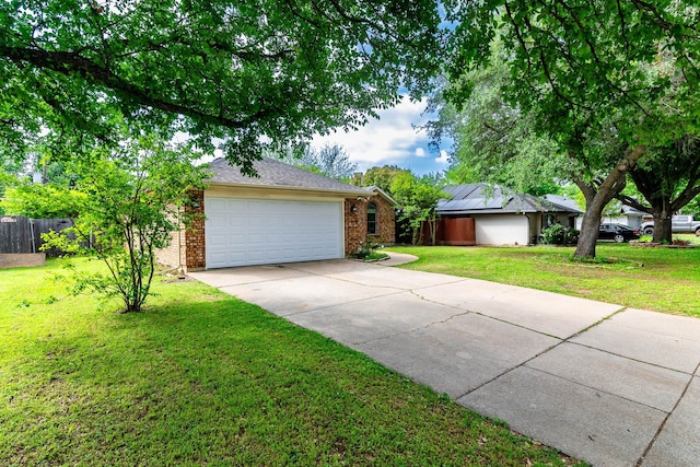 view of front of property with a garage, brick siding, a front lawn, and concrete driveway