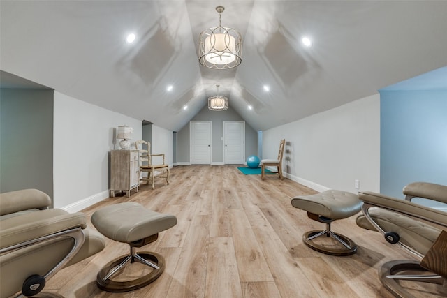 living area featuring recessed lighting, wood finished floors, lofted ceiling, and baseboards