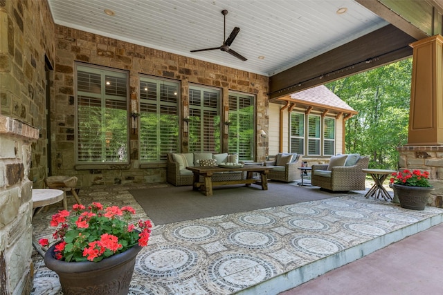 view of patio with ceiling fan and an outdoor living space